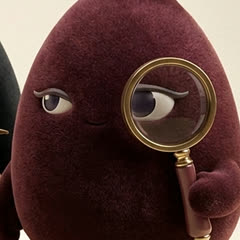 The Second Opinion, maroon, looking through a magnifying glass